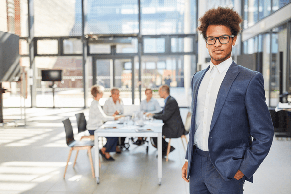 A confident founder who knows his value before a sales meeting