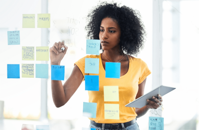 A founder making notes about what she expects for and from her team