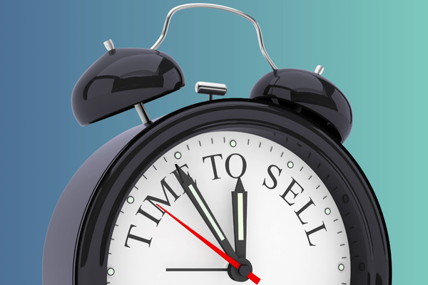 A clock with Time to Sell on it