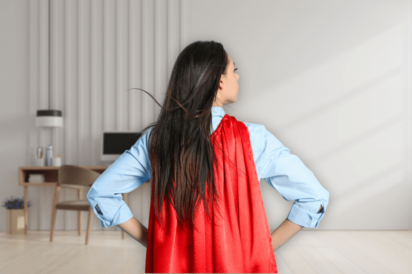 Female founder bravely overcoming fear in sales as illustrated with superhero-style cape