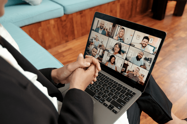 Person practicing sales conversation with a group of peers online