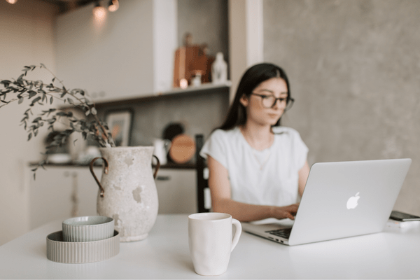 A focused woman able to work without interruption due to mode blocking her workday